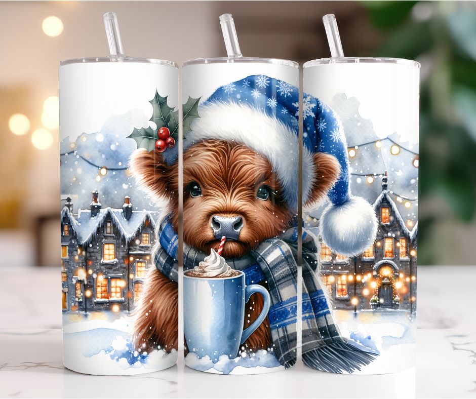 20 oz. Baby Highland Cow w/Blue Snowflake Hat Sipping Hot Chocolate